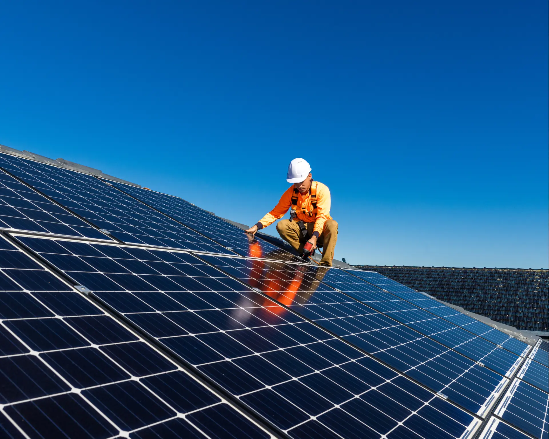 Carbon Save installer fitting solar panels to a commercial solar array